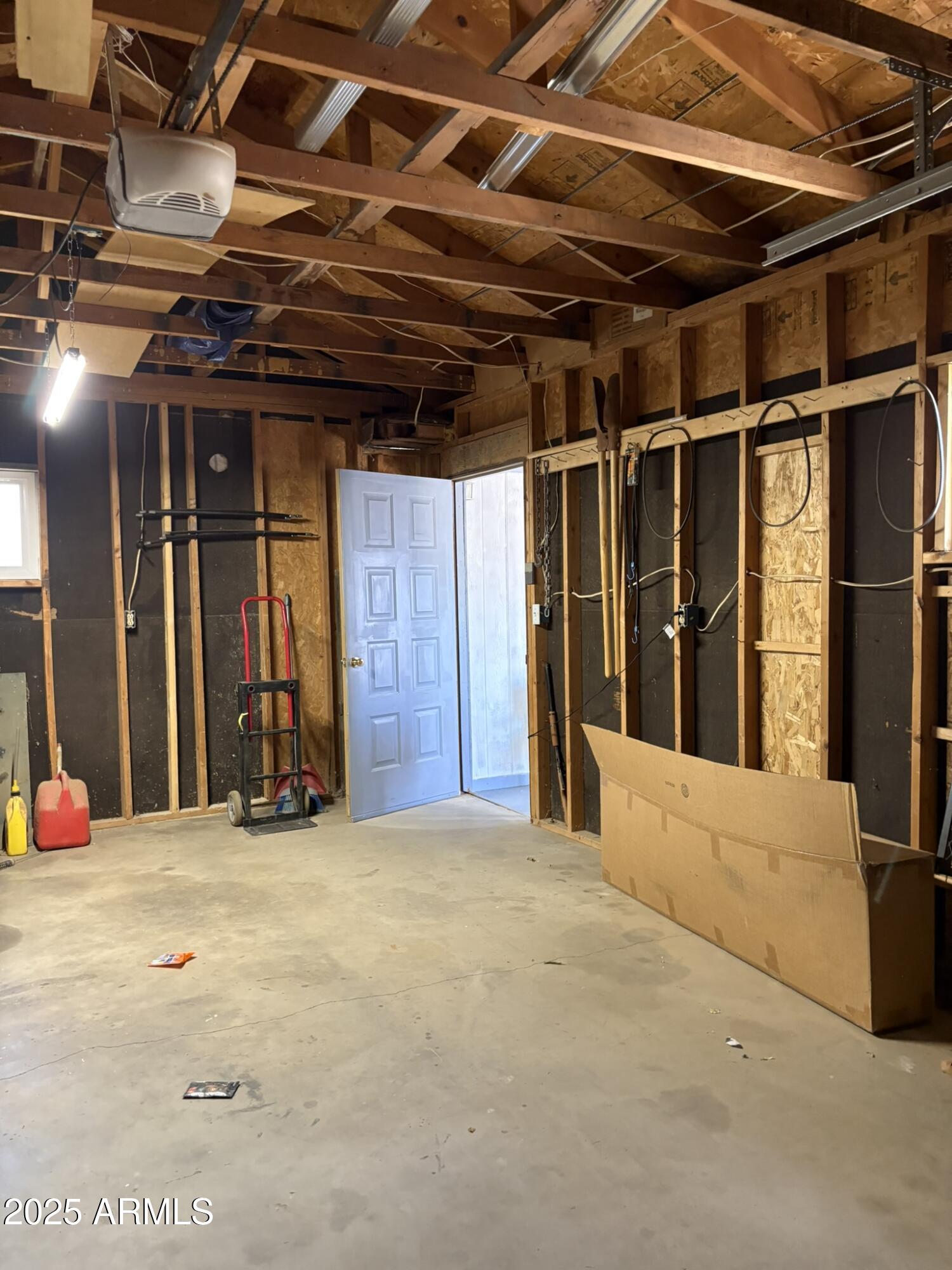 3372 North Hunt Road Golden Valley, AZ 86413 - Photo 17 of 18 a view of a room with wooden walls