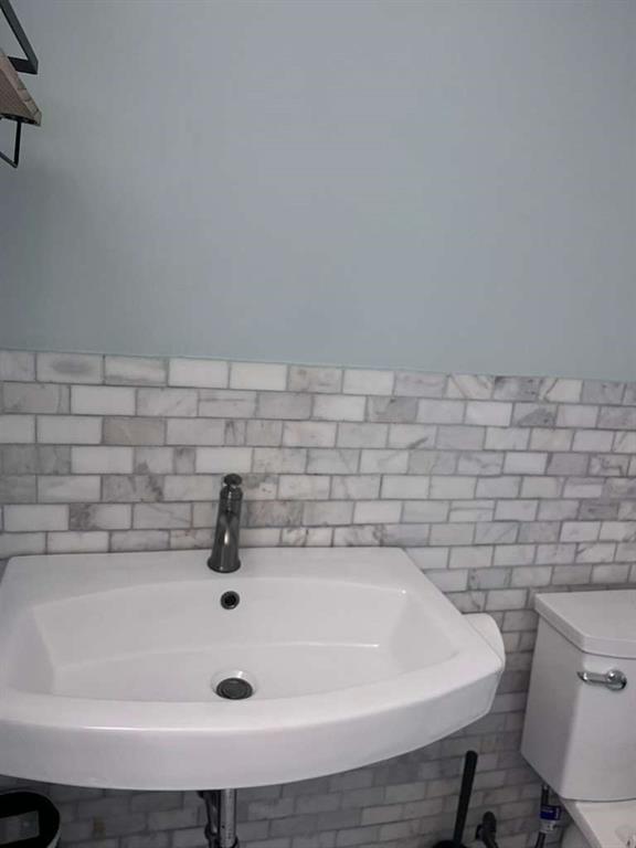 20441 Northeast 30th Avenue, Unit 110 Miami, FL 33180 - Photo 11 of 16 a bathroom with a sink