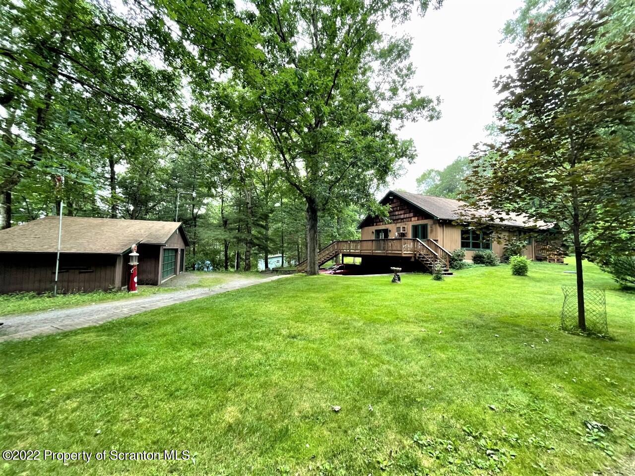 17 Center Road Hawley, PA 18428 - Photo 3 of 38 a view of a house with backyard and garden