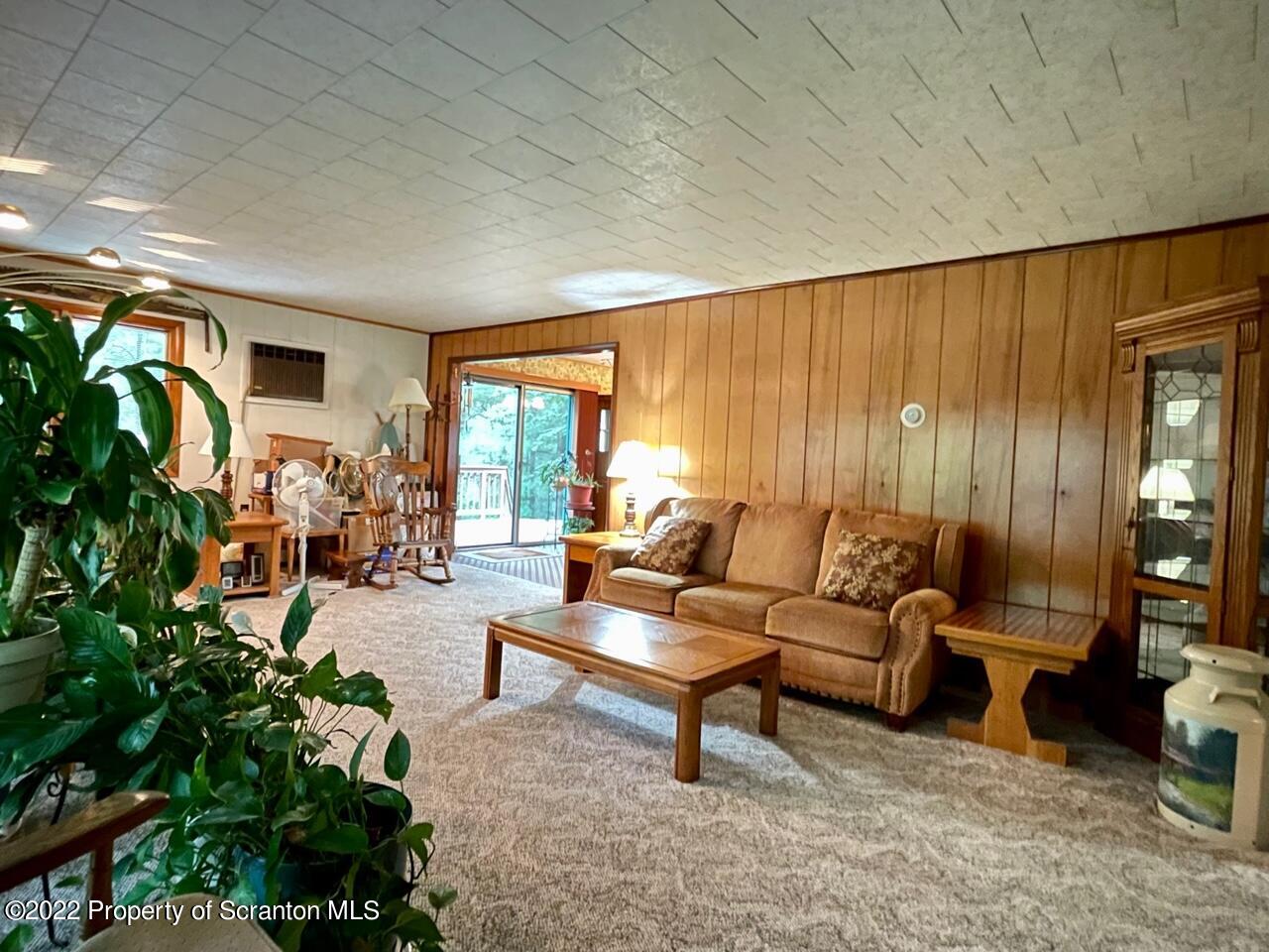 17 Center Road Hawley, PA 18428 - Photo 8 of 38 a living room with furniture and a large window