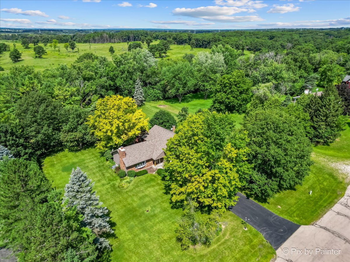 6403 Ridgeview Drive Huntley, IL 60142 - Photo 1 of 35 a view of a garden with a building in the back