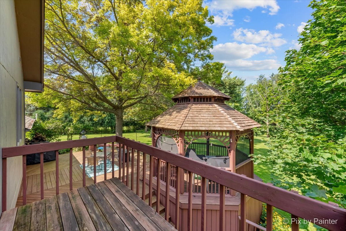 6403 Ridgeview Drive Huntley, IL 60142 - Photo 17 of 35 a view of a wooden deck next to a yard