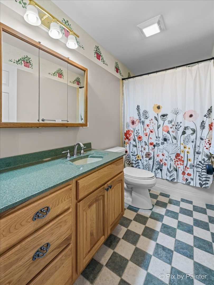6403 Ridgeview Drive Huntley, IL 60142 - Photo 21 of 35 a bathroom with a granite countertop sink and a mirror
