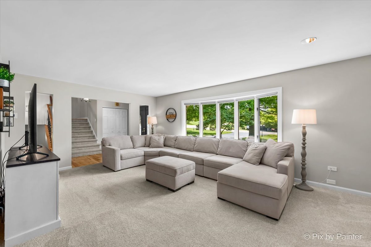 6403 Ridgeview Drive Huntley, IL 60142 - Photo 5 of 35 a living room with furniture and large windows