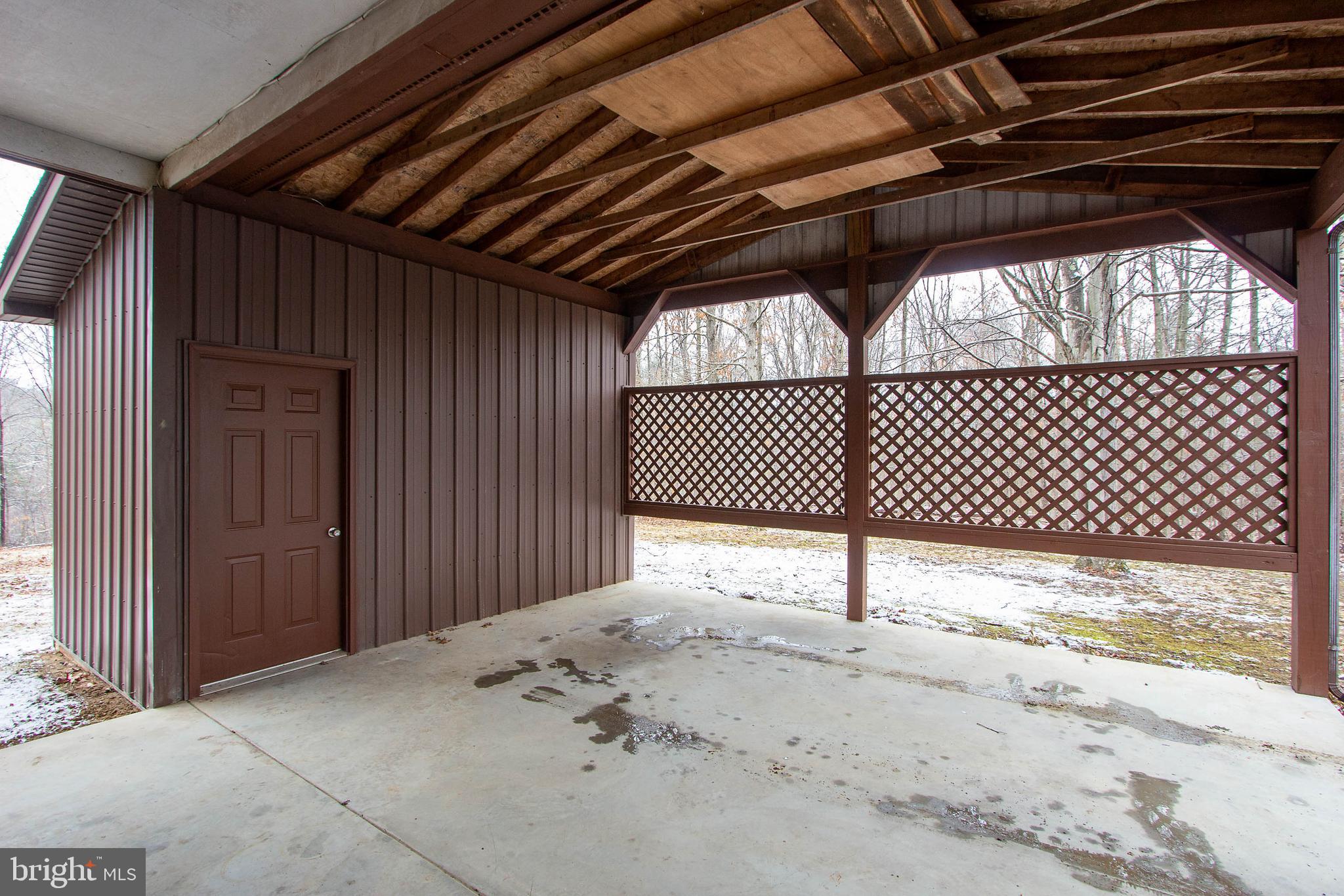 1419 Cauthorn Mill Road Middletown, VA 22645 - Photo 34 of 42 REAR CARPORT WITH DOOR TO KITCHEN AND STORAGE SHED