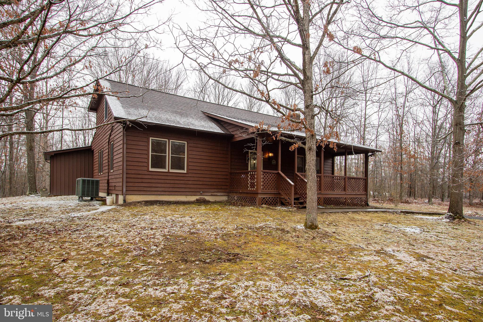 COZY FRONT PORCH TO ENJOY TREED VIEW!