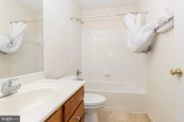 a bathroom with a sink a toilet and a bathtub