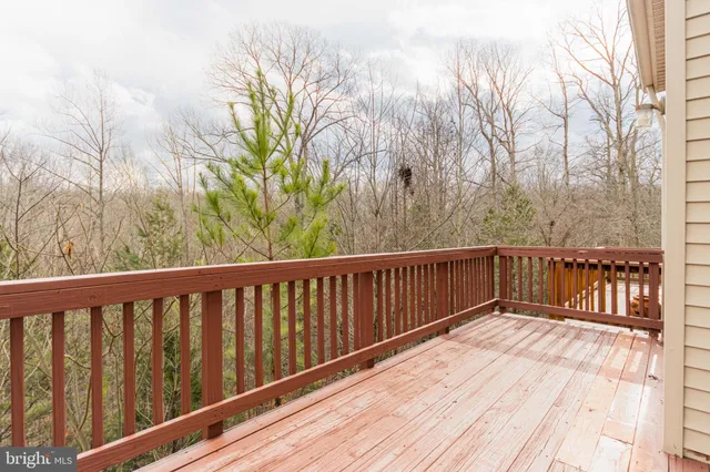 a balcony with trees in front of it