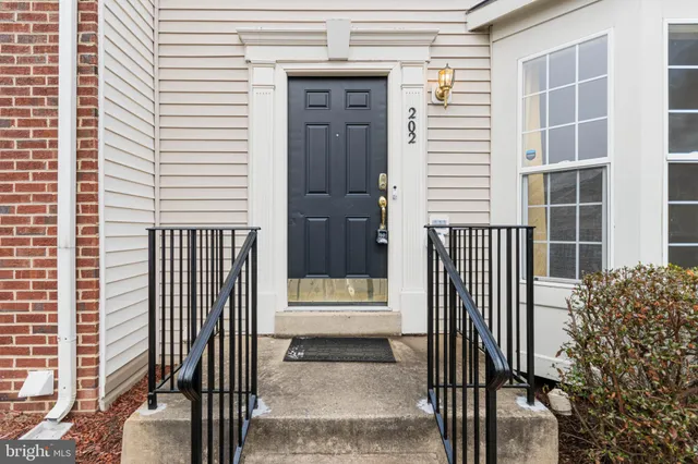 a view of a house with a door and wooden floor
