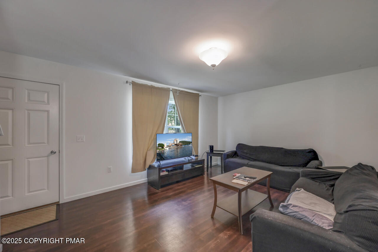 207 Game Lane Blakeslee, PA 18610 - Photo 12 of 55 a living room with furniture and a wooden floor