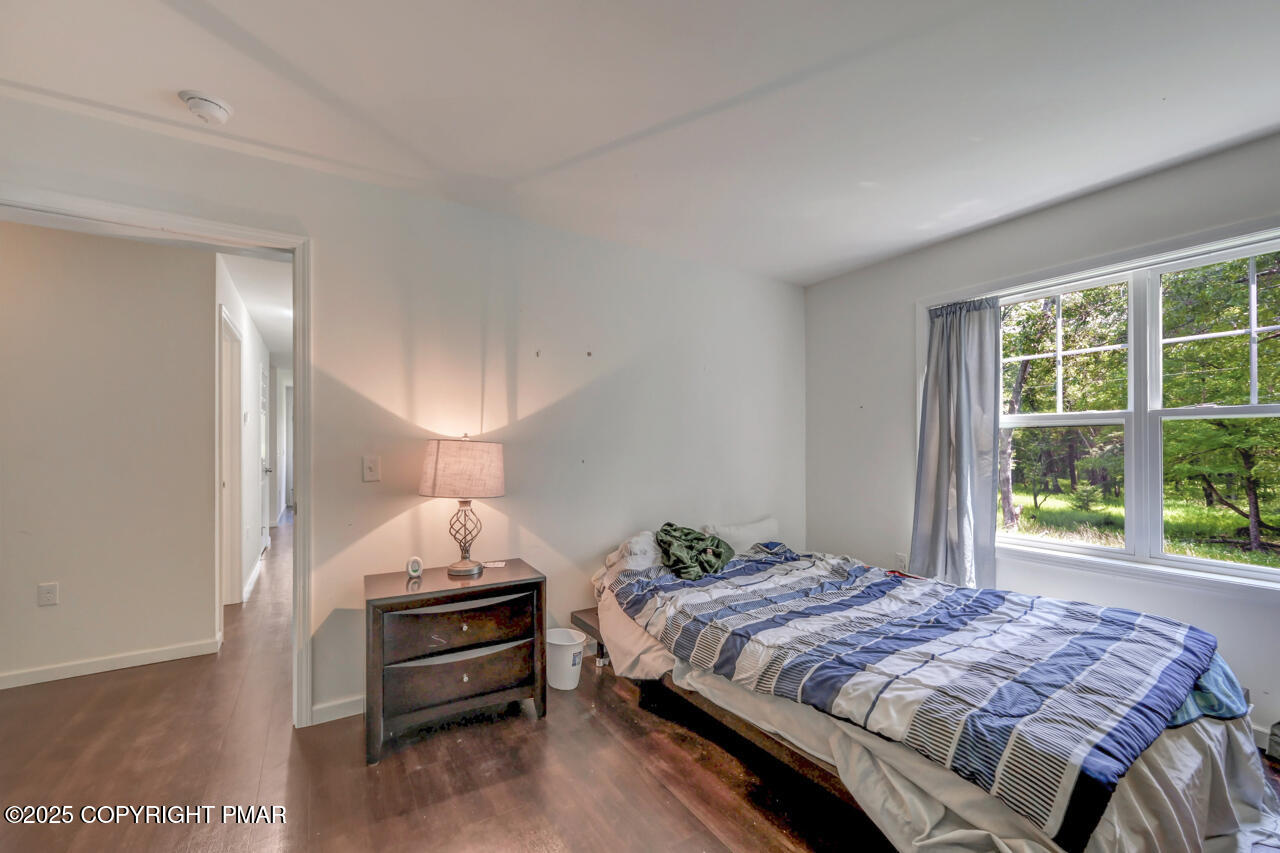 207 Game Lane Blakeslee, PA 18610 - Photo 26 of 55 a bedroom with a bed and a window