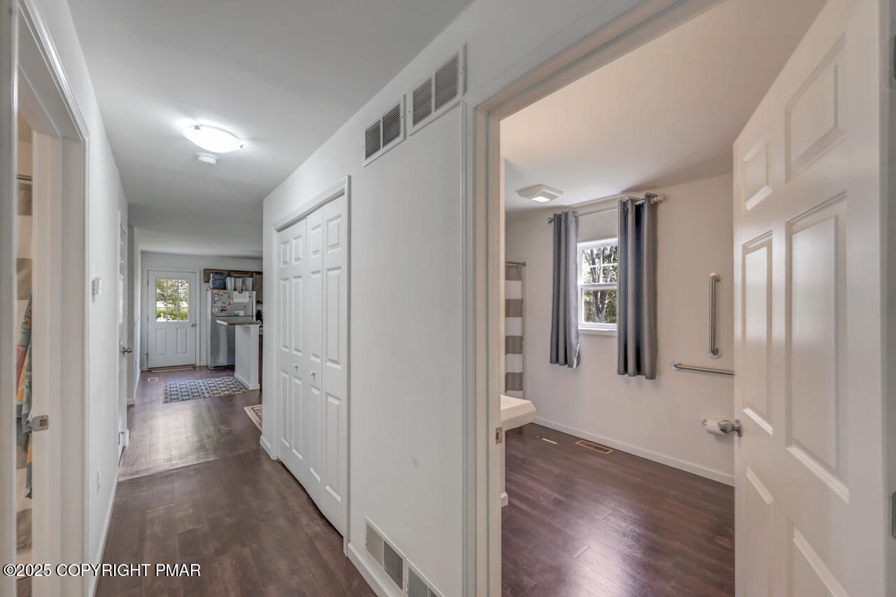 207 Game Lane Blakeslee, PA 18610 - Photo 30 of 55 a view of a hallway with wooden floor