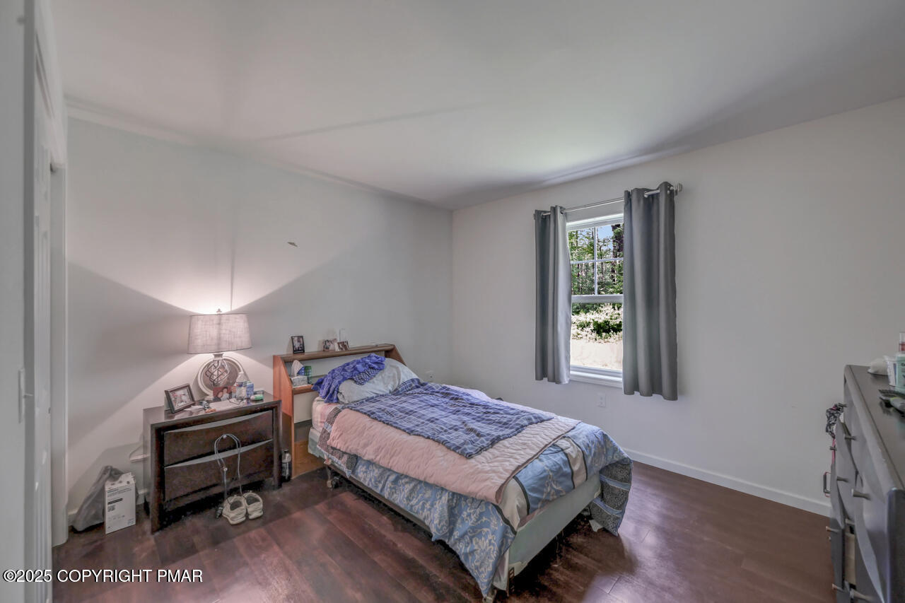 207 Game Lane Blakeslee, PA 18610 - Photo 33 of 55 a bedroom with a bed and a window