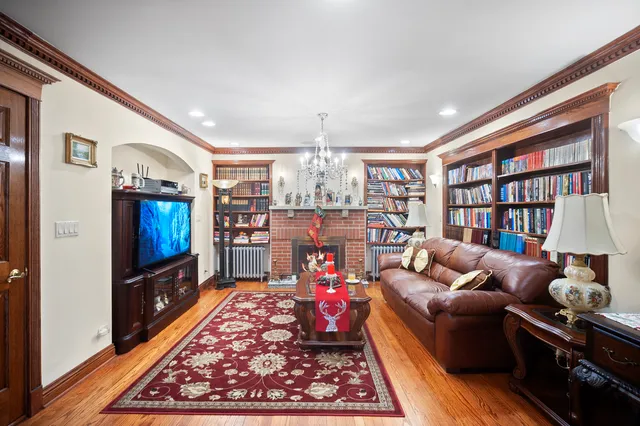 a living room with furniture a rug and a flat screen tv