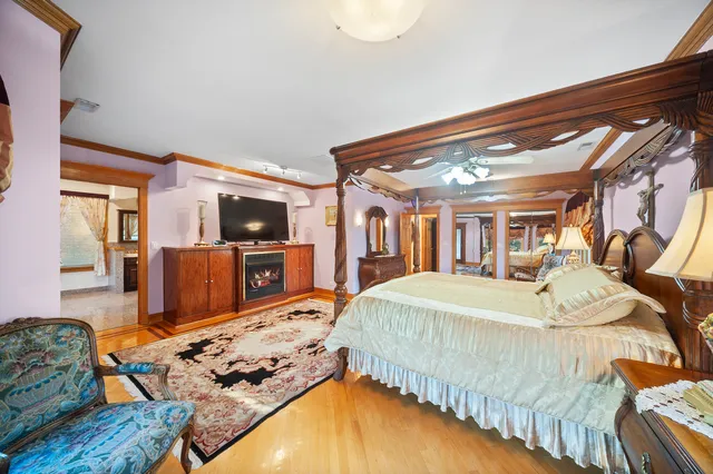 a bed room with a bed and a television