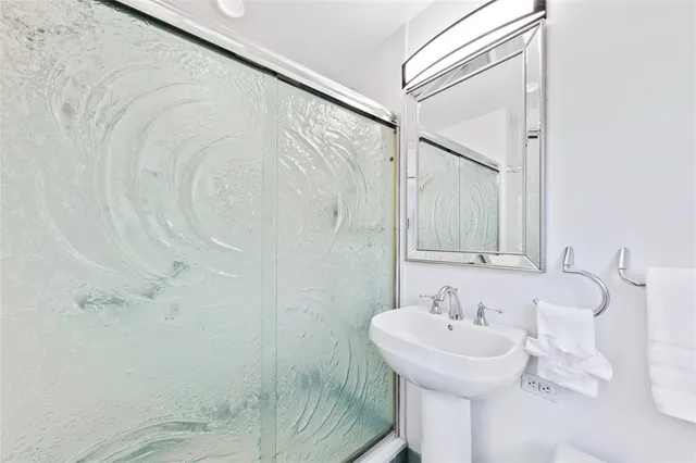 a bathroom with a sink and mirror