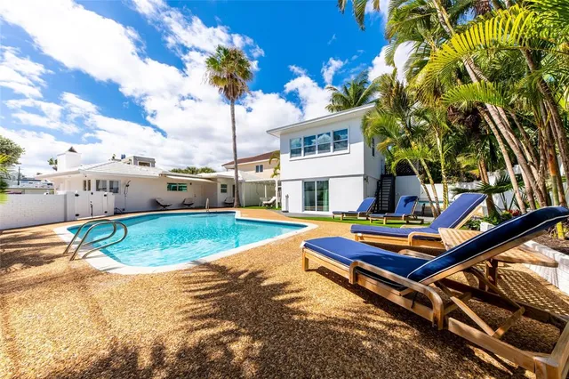 a wooden bench sitting in front of a building