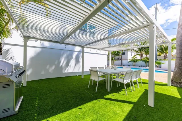 a view of an chairs and table in patio