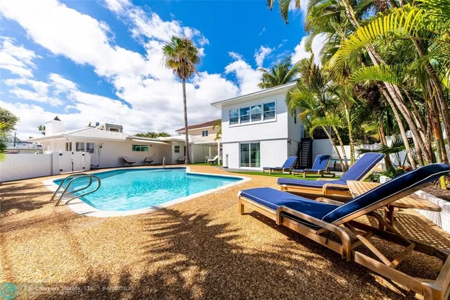 a wooden bench sitting in front of a building