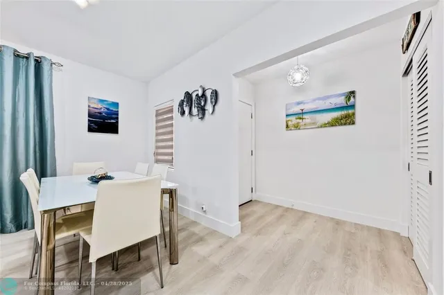 a view of a livingroom with furniture and a flat screen tv