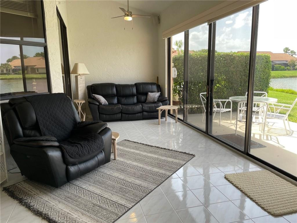Undisclosed Address Boynton Beach, FL 33472 - Photo 15 of 41 a living room with furniture and a floor to ceiling window