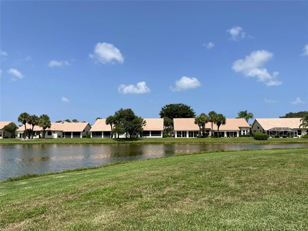 Undisclosed Address Boynton Beach, FL 33472 - Photo 17 of 41 a view of a lake with houses in the background