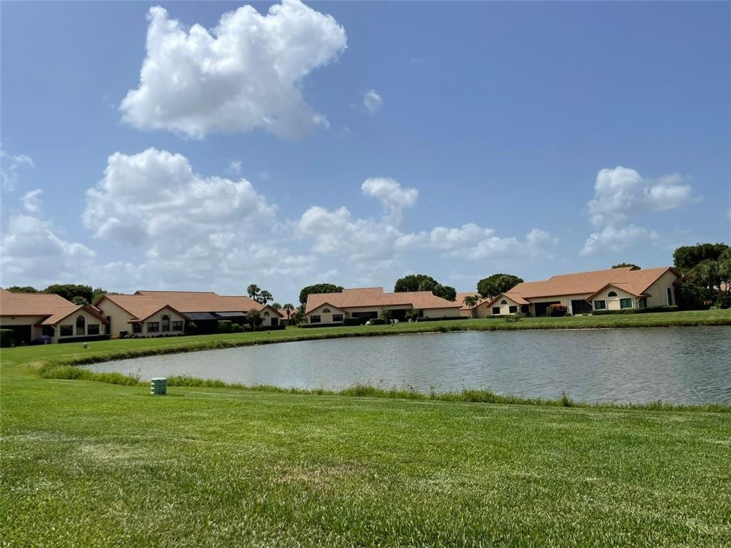Undisclosed Address Boynton Beach, FL 33472 - Photo 18 of 41 a view of a lake with houses in the background