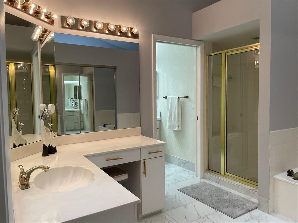 Undisclosed Address Boynton Beach, FL 33472 - Photo 23 of 41 a bathroom with a tub sink and mirror