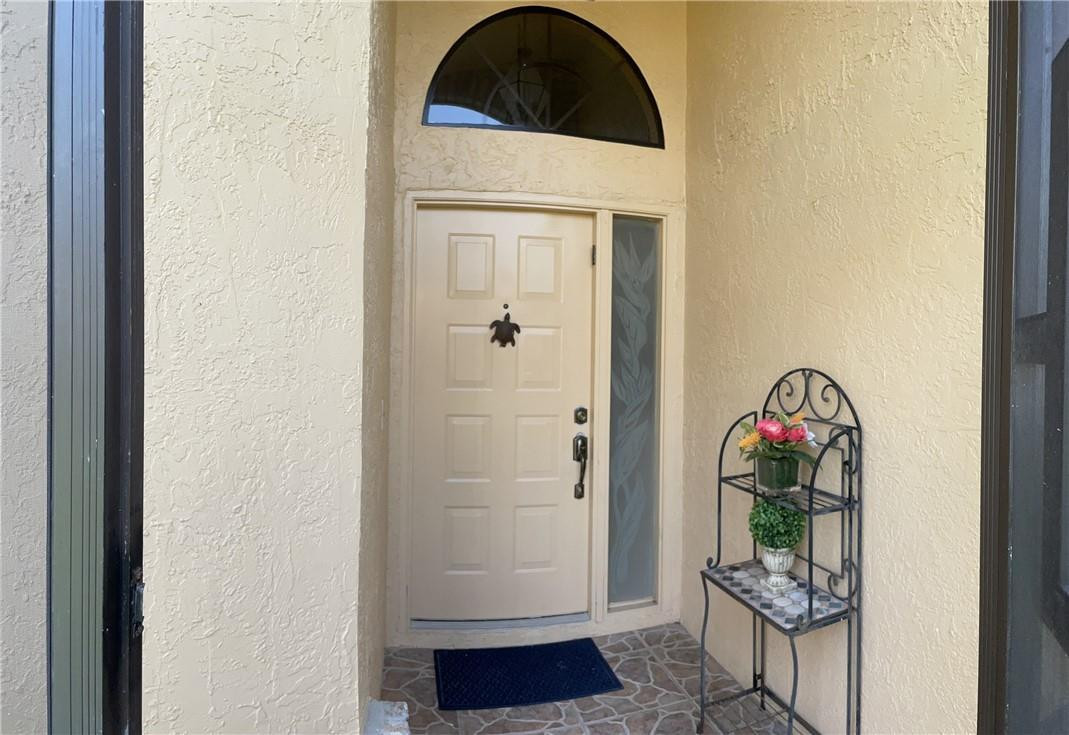 Undisclosed Address Boynton Beach, FL 33472 - Photo 35 of 41 a view of entryway with wooden floor