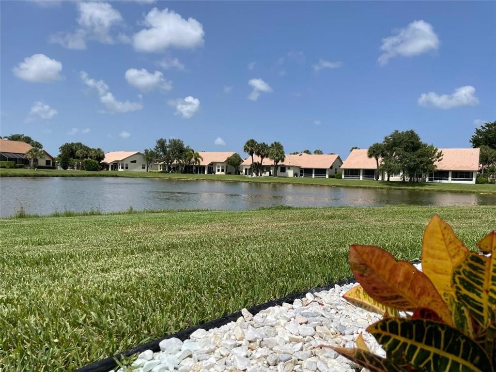 Undisclosed Address Boynton Beach, FL 33472 - Photo 40 of 41 a view of a lake with houses in the back