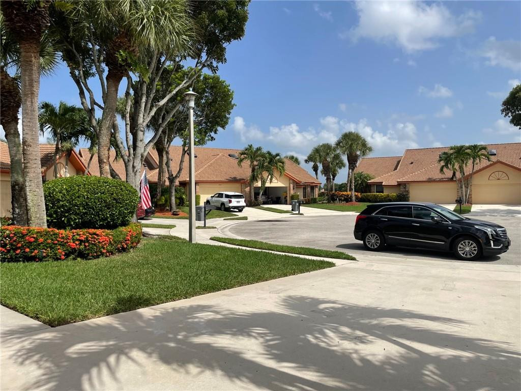 Undisclosed Address Boynton Beach, FL 33472 - Photo 41 of 41 a view of street with parked cars