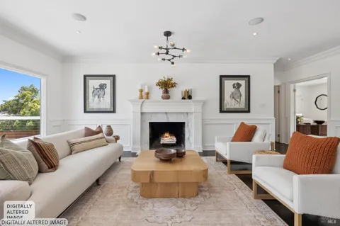 a living room with furniture a flat screen tv and a floor to ceiling window