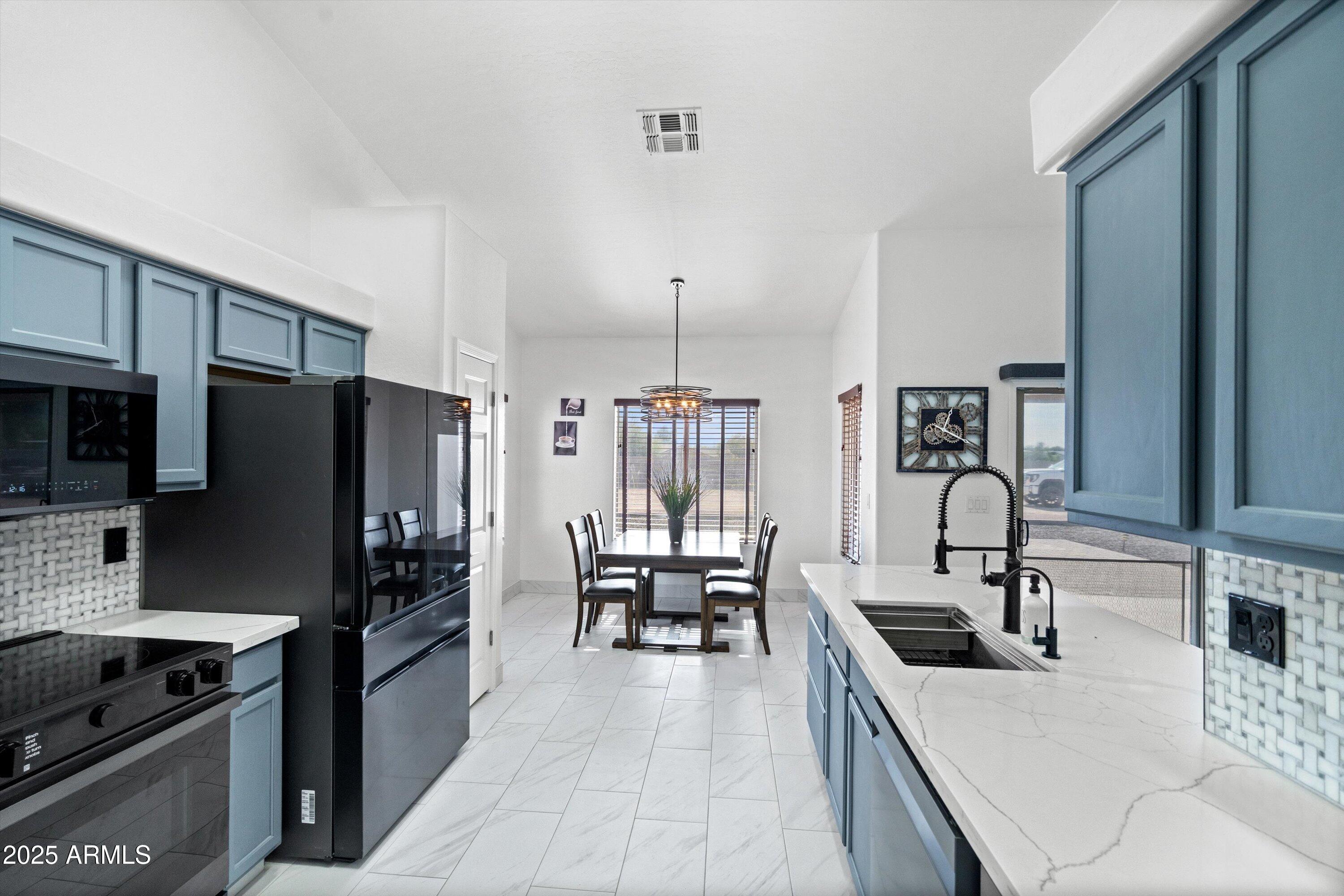2322 South Tuthill Road Buckeye, AZ 85326 - Photo 16 of 46 19-Kitchen to Dining