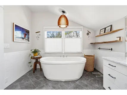 a bathroom with a sink and a window