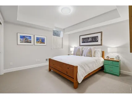 a bedroom with a bed and a table