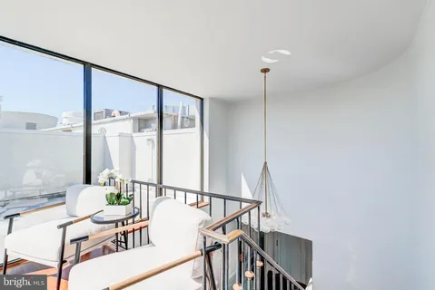 a view of a room with furniture and window