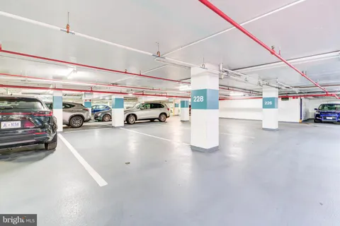 a view of parking area with parked cars