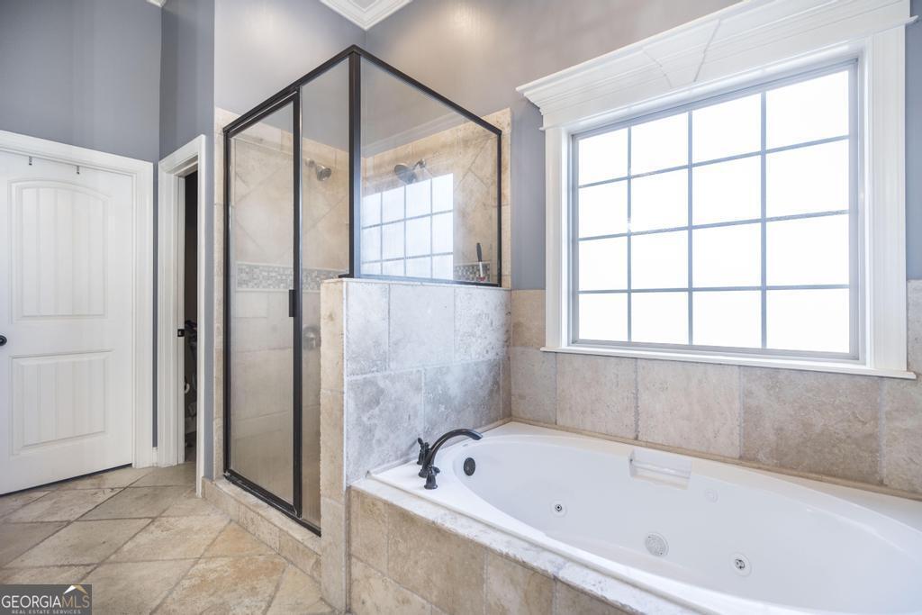 4065 Gordon Road Abbeville, GA 31001 - Photo 23 of 48 a bathroom with a tub shower and sink
