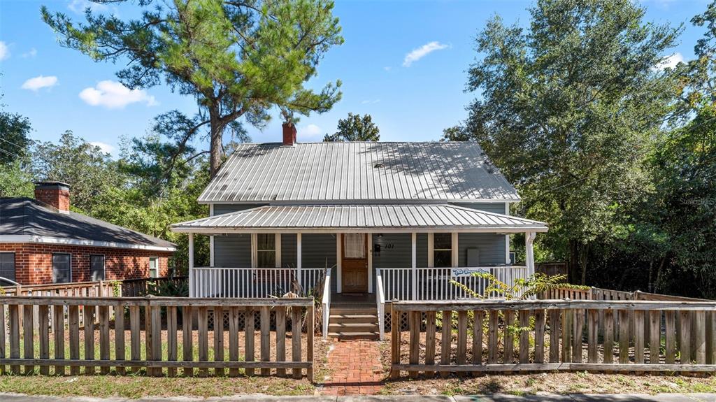 101 Northeast 9th Street Gainesville, FL 32601 - Photo 1 of 35 a front view of a house with a porch