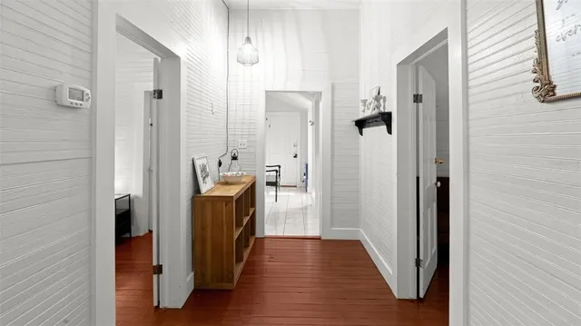 a view of a bathroom from a hallway