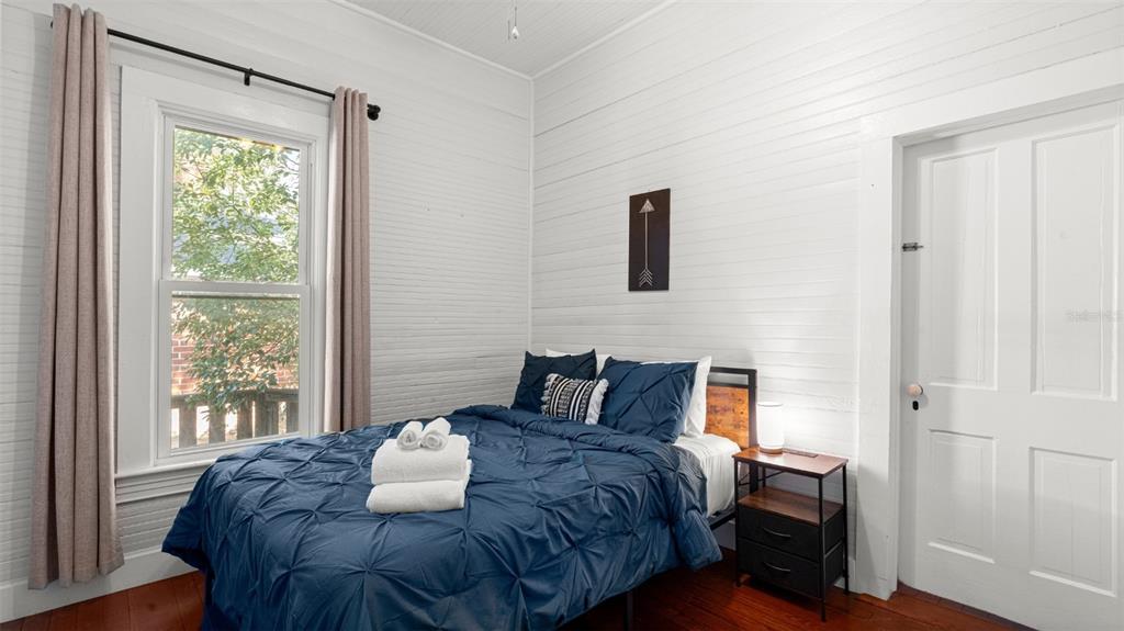 101 Northeast 9th Street Gainesville, FL 32601 - Photo 14 of 35 a bedroom with a bed and a window