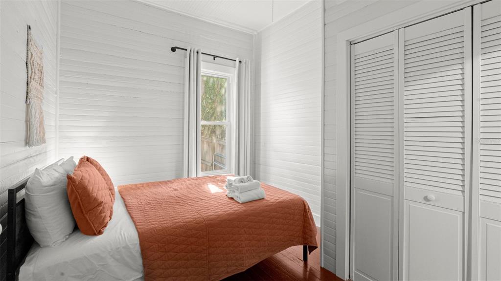 101 Northeast 9th Street Gainesville, FL 32601 - Photo 17 of 35 a bedroom with a bed and a window