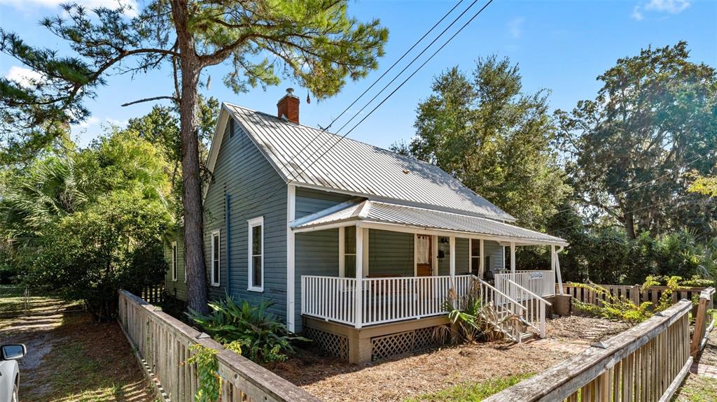 101 Northeast 9th Street Gainesville, FL 32601 - Photo 2 of 35 a view of house with trees in the background
