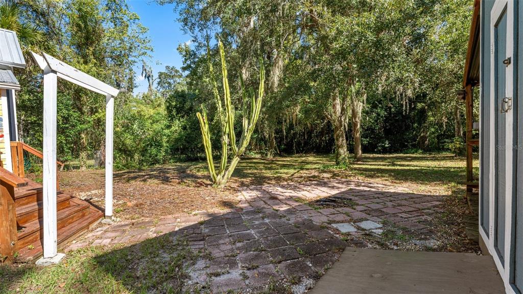 101 Northeast 9th Street Gainesville, FL 32601 - Photo 29 of 35 a view of a house with backyard and a tree