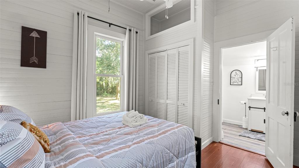 101 Northeast 9th Street Gainesville, FL 32601 - Photo 10 of 35 a bedroom with a bed and a window