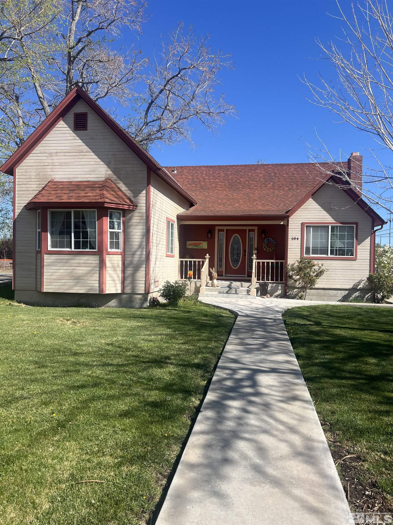 104 Virginia Street Yerington, NV 89447 - Photo 1 of 15 a front view of a house with a yard