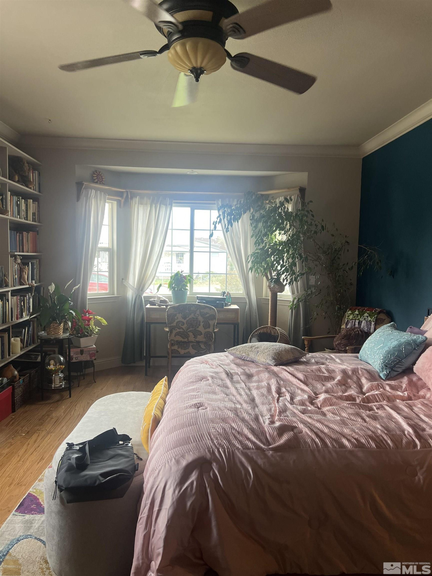 104 Virginia Street Yerington, NV 89447 - Photo 11 of 15 a bed sitting in a bedroom next to a window