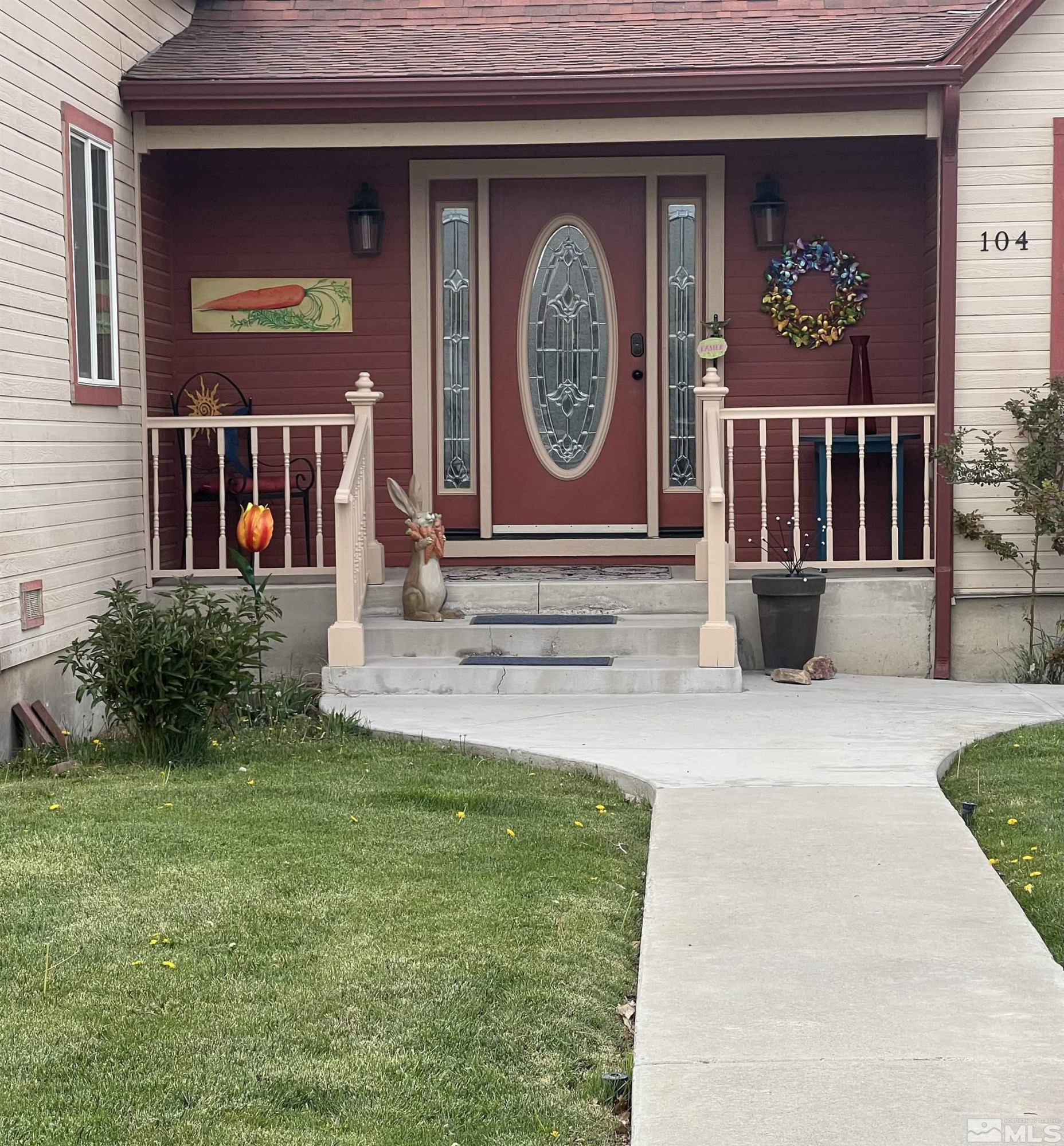 104 Virginia Street Yerington, NV 89447 - Photo 2 of 15 a view of a house with a small yard and a large tree