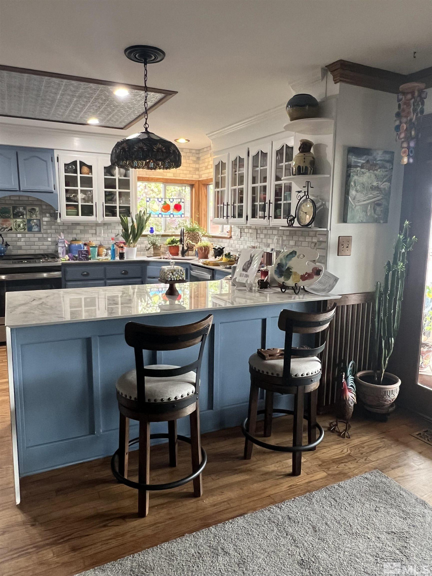 104 Virginia Street Yerington, NV 89447 - Photo 4 of 15 a kitchen with a dining table chairs stove and kitchen view