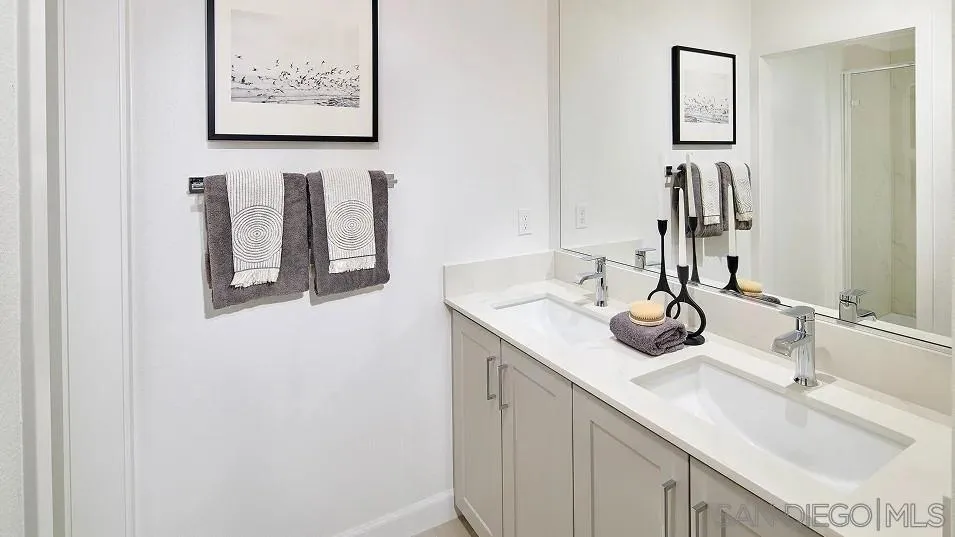 1212 Mountain Laurel Road San Marcos, CA 92078 - Photo 13 of 18 a bathroom with a sink and a mirror